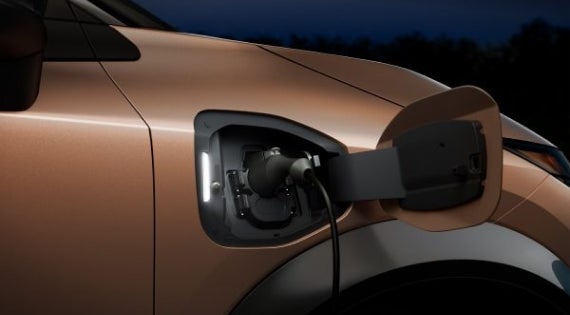 Close-up image of charging cable plugged in | Reiselman Nissan in Kansas City MO