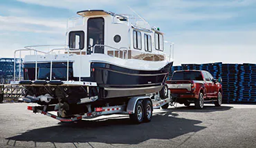 2022 Nissan TITAN Truck towing boat | Reiselman Nissan in Kansas City MO
