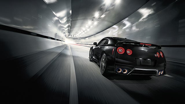2023 Nissan GT-R seen from behind driving through a tunnel | Reiselman Nissan in Kansas City MO